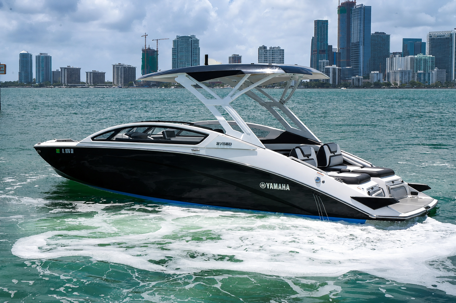 Side profile of The Content Boat on the water