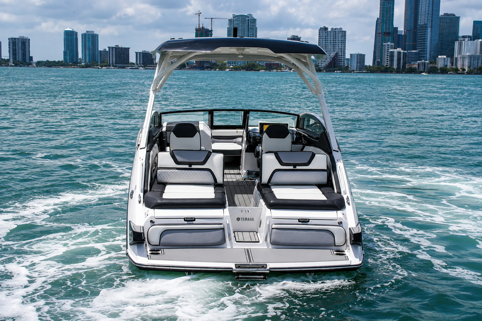 Stern view of The Content Boat with city skyline
